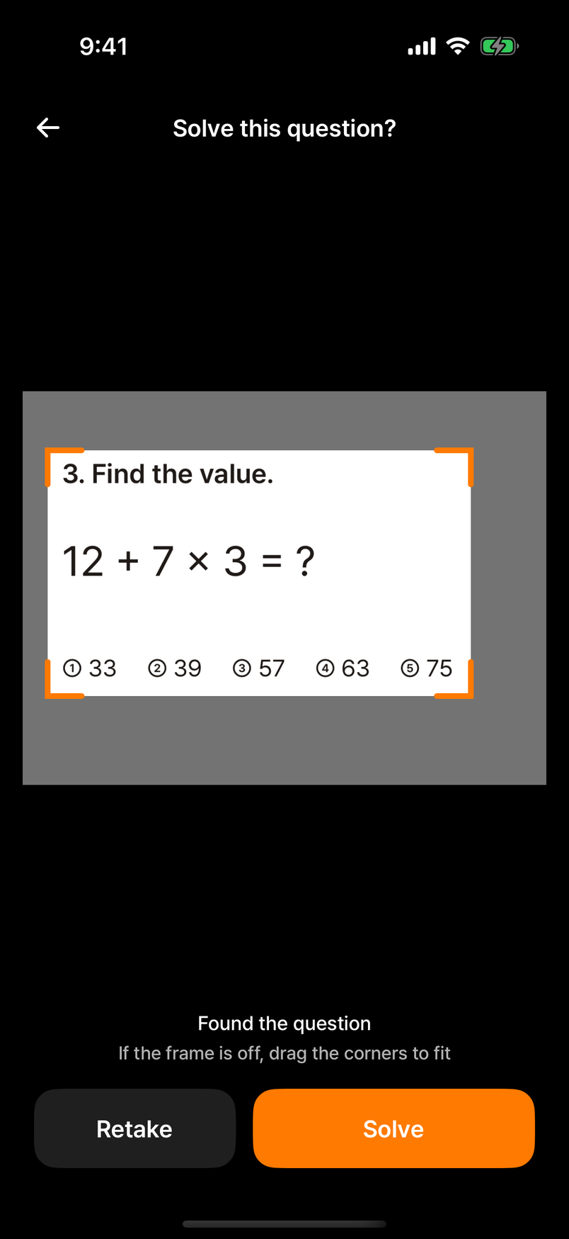 Photo review screen: the photo with a notice that the question was found, an orange crop frame, and Retake and Solve buttons below